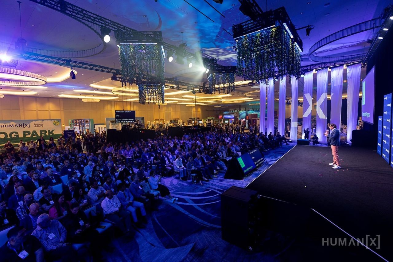 A packed keynote room at HumanX, with the audience facing the main stage.