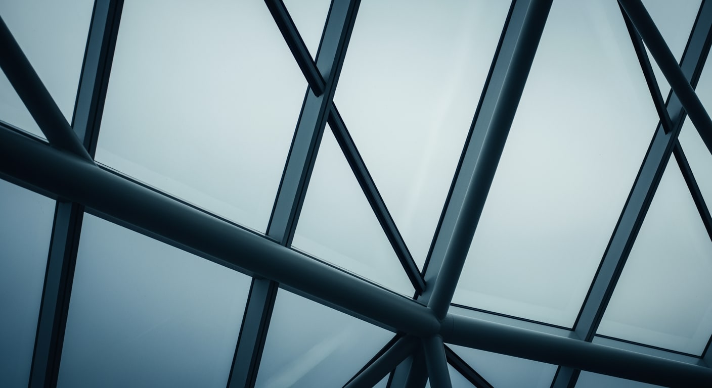 Architectural detail of a modern conference hall, focusing on a geometric pattern of glass and steel under diffuse light